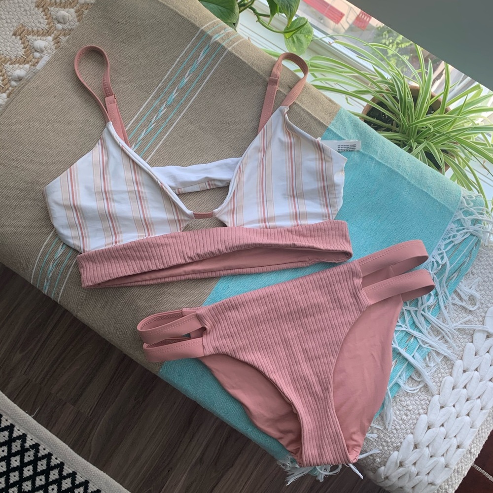 Tavik swim suit top is a small and bottoms xs